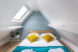 מיטה או מיטות בחדר ב-Le Petit Pastel - Joli duplex - Proche de la plage