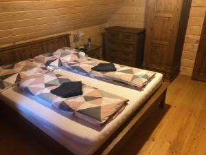 Postel nebo postele na pokoji v ubytování Chalúpka pri Mare