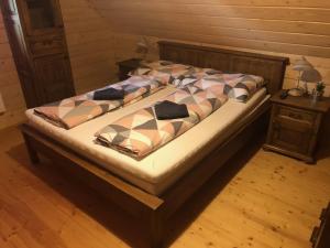Postel nebo postele na pokoji v ubytování Chalúpka pri Mare