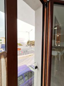 a sliding glass door with a view of a street at Descanso y Encanto en Vilaflor in Vilaflor
