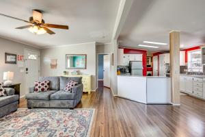 a living room with a couch and a kitchen at La Verkin Home with Yard, Covered Patio and Grill in La Verkin