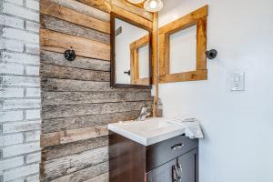 a bathroom with a sink and two mirrors at La Verkin Home with Yard, Covered Patio and Grill in La Verkin +18 photos