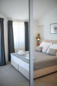 a bedroom with a large bed with a mirror at Holiday Home Kiara in Brtonigla +53 photos