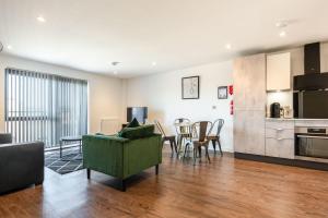 a living room with a couch and a table at Modern 2 bed 2 bath apartment in the heart of York in York