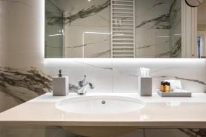 a bathroom with a sink and a mirror at Gonfalone 6 in Rome +287 photos