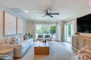 a living room with a couch and a ceiling fan at Pet-Friendly Retreat in Stuart with Saltwater Pool! in Stuart