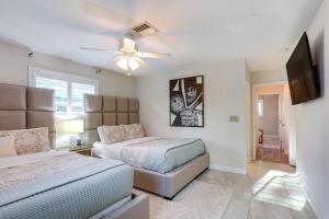 a bedroom with two beds and a ceiling fan at Pet-Friendly Retreat in Stuart with Saltwater Pool! in Stuart +20 photos