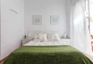 Cama o camas de una habitación en San Juan Apartamento