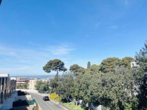 a view of a street with trees and a road at Marcenac - T2 en Résidence, Clim, Parking, terrasse in Sète