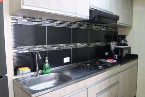 Küche/Küchenzeile in der Unterkunft Cómodo Apartamento Amoblado en Condominio