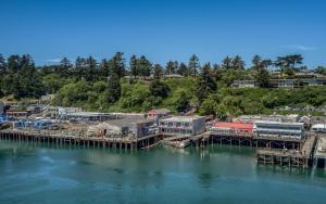 a dock with a train on it in the water at Captains Quarters - Anchor Pier Lodge in Newport