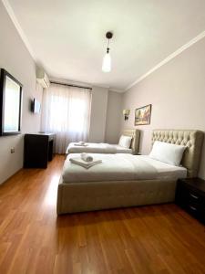 Postel nebo postele na pokoji v ubytování Prince Hotel