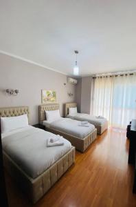Postel nebo postele na pokoji v ubytování Prince Hotel