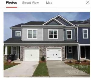 a picture of a house with a garage at Embrace the Harmony of Nature and Urban Living in Concord