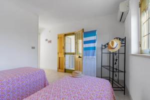 A bed or beds in a room at Casa della Cupa