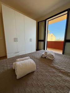 Llit o llits en una habitació de Oasi Kite - Stagnone Apartments