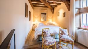 Postel nebo postele na pokoji v ubytování Le Champ des Oiseaux Hôtel & Spa