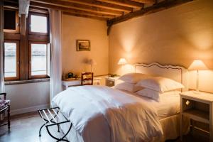 Postel nebo postele na pokoji v ubytování Le Champ des Oiseaux Hôtel & Spa