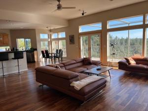 a living room with a couch and a table at Stunning Mountaintop Resort in Placerville
