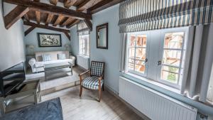 Postel nebo postele na pokoji v ubytování Le Champ des Oiseaux Hôtel & Spa