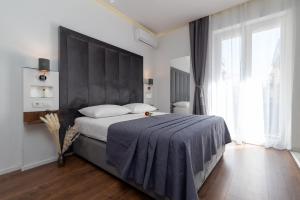 Antares Luxury Rooms 2客房内的一张或多张床位