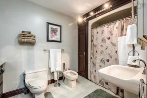 a bathroom with a white toilet and a sink at Private Bedroom and Bathroom in Dartmouth in Halifax