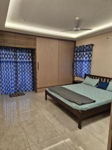 a bedroom with two beds in a room at Swayamkrushi 2nd Floor in Hyderabad