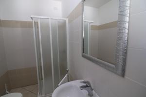 a bathroom with a sink and a mirror at Villetta Amelie a Otranto in Otranto
