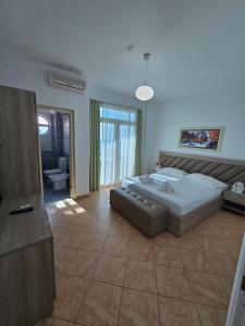 a large bedroom with a large bed and a bathroom at BLUE AMR in Durrës +57 photos
