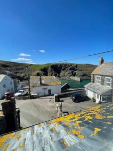 a view from the roof of a house with a parking lot at Atlantic Cottage Port Isaac 2 bedroom with parking in Port Isaac