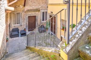 a stairway leading up to a house with a door at La Terrazza - Together in Tuscany in Cortona
