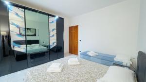 Katil atau katil-katil dalam bilik di Appartamento al Mare