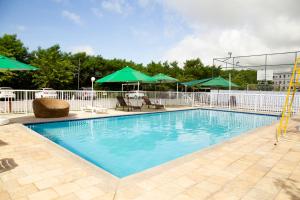 Swimmingpoolen hos eller tæt på Apartamento Aconchego beach