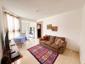 Et tv og/eller underholdning på Apartamento Aconchego beach