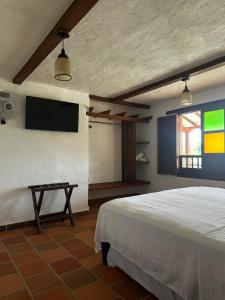 Et tv og/eller underholdning på Cabaña Don Berna Barichara + 15 billeder