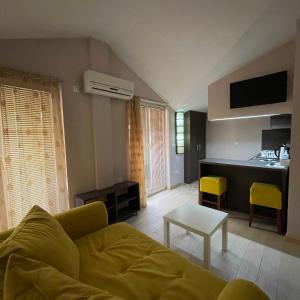 a living room with a couch and a table at Di Angolo Apartments in Ohrid