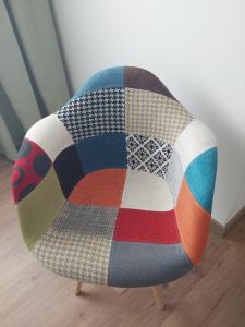 a chair with a blanket on top of it at Quinta das Laranjeiras in Marinhais