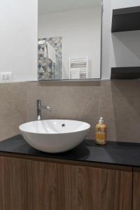 a white sink on a counter in a bathroom at Le case di vada/ appartamento le Dune in Vada