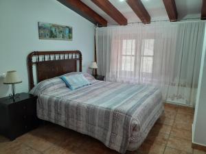 Postel nebo postele na pokoji v ubytování Casa Manolita