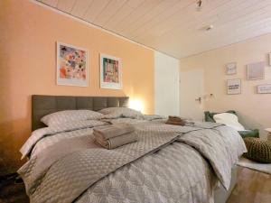 a bedroom with a large bed with two pillows on it at Wohnung nahe Messe und Zentrum in Nuremberg