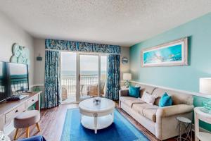 a living room with a couch and a table at Bay Watch 0536 in Myrtle Beach