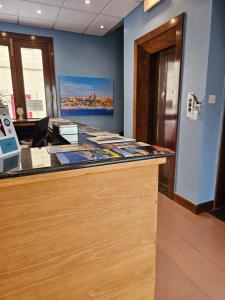 an office cubicle with a desk with a counter top at La Playa Hotel in Marsalforn