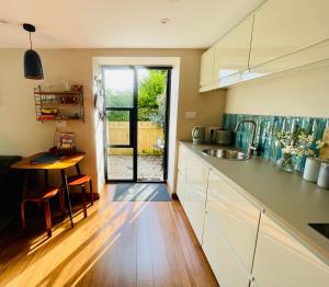 a kitchen with a sink and a counter top at The Hideaway Apartment, Bath in Bath