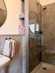 a bathroom with a shower and a sink at Selfoss Center apartment in Selfoss +4 photos