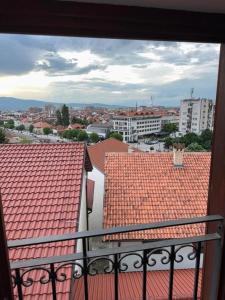 a view of a city from a balcony with red roofs at Apartments Prizreni in Prizren