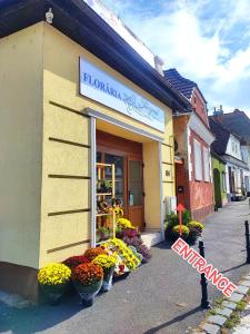 a flower shop with flowers in front of it at Prime Residence in Braşov