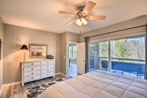 a bedroom with a bed and a ceiling fan at Lake Keowee Resort Condo Pool, Beach, Golf Access in Salem +27 photos