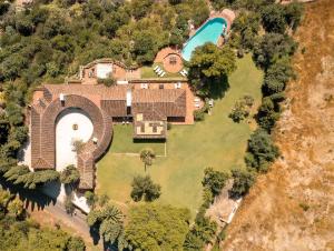 an aerial view of a house with a swimming pool at 7,000 sqm Luxurious Villa with Panoramic Sea Views Multiple Gardens & Two Pools in Benalmádena