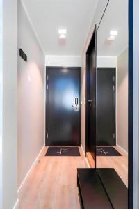 a hallway with two elevators in a building at **ROYAL SUITE ** MODERN ** FAST - WIFI ** SMART TV ** in Oslo