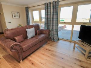 TV a/nebo společenská místnost v ubytování Nook Cottage